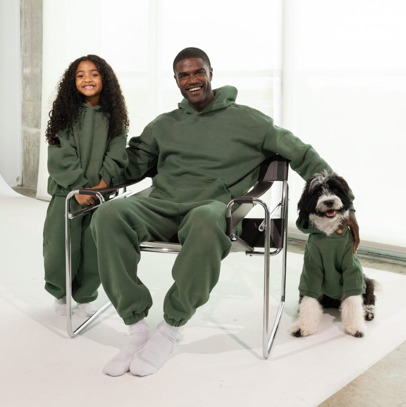 Family in matching Comfrt sets with their dog